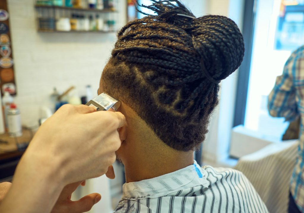 Anonymous hairstylist doing a haircut