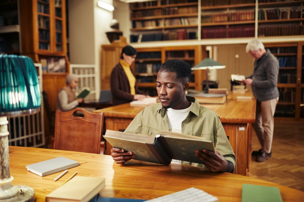 Young Black Man Reading in Craven County Library